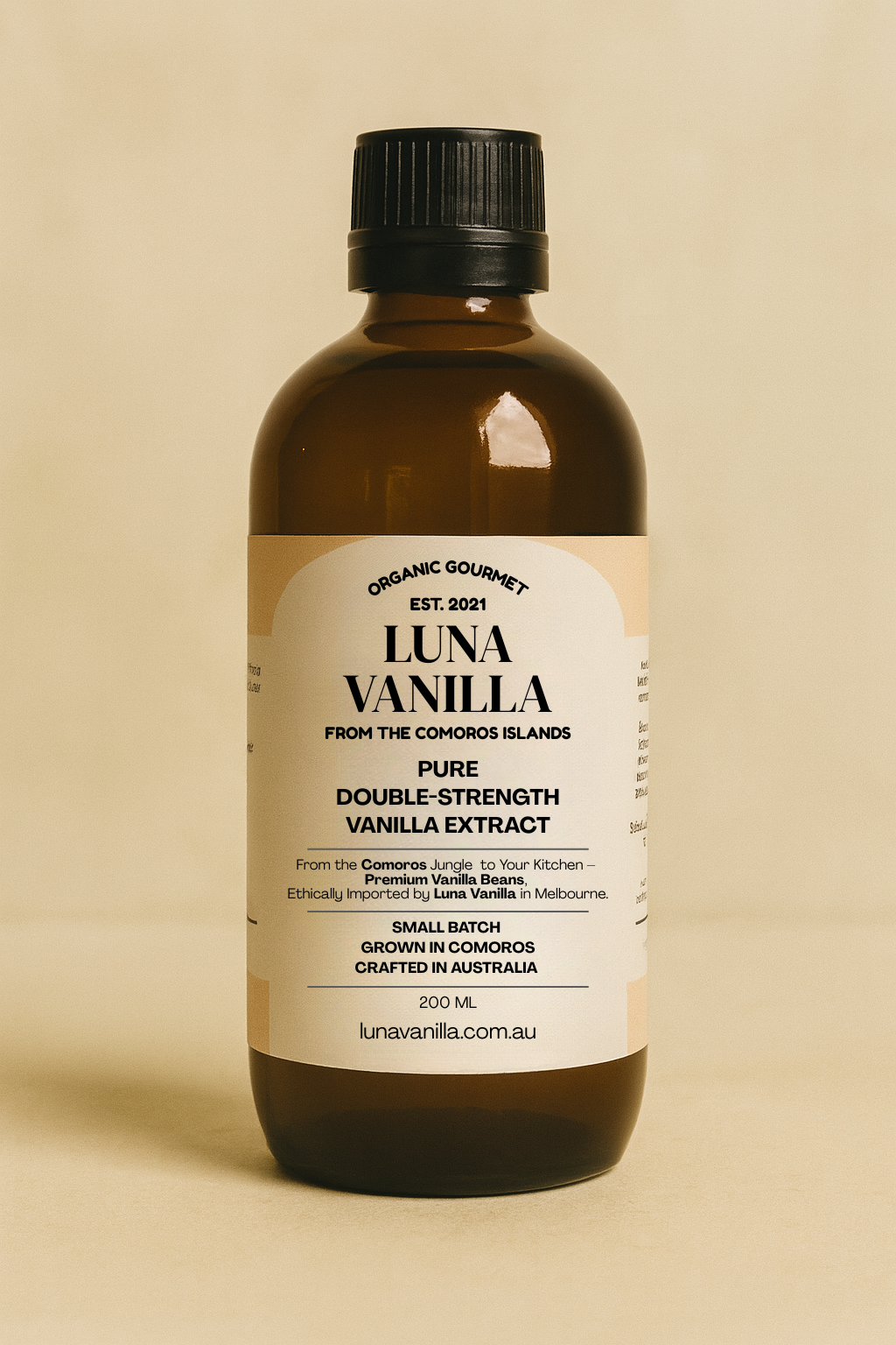 A 200ml bottle of Luna Vanilla pure double-strength vanilla extract displayed against a warm beige background.