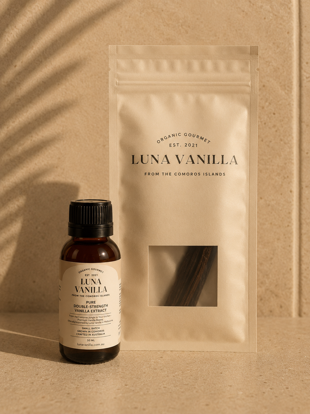 Luna Vanilla Essentials Bundle - 5 Bourbon Vanilla Beans + 50 mL Double-Fold Vanilla Extract on a beige background