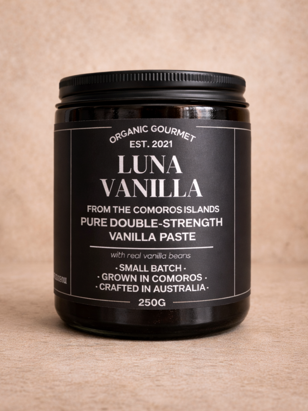 Jar of Luna Vanilla vanilla paste on a beige background