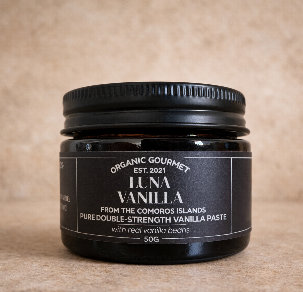 Jar of Luna Vanilla paste with a black label on a beige background